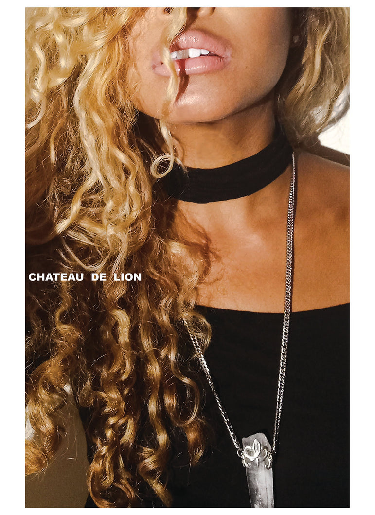 Samadhi clear quarts crystal amulet necklace with sterling silver fluer de lis motif made by chateau de lion being worn by a model. cdl-neck-smdhi-clr-qrtz-01