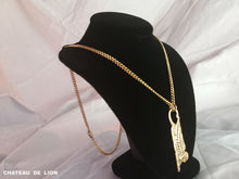 the egyptian sphinx penant necklace in 14k gold made by chateau de lion side view.  cdl-neck-sphx-gld-01