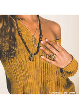 The Fluer De Lis ring in 14k gold made by chateau de lion. worn by a model   cdl-rg-flr-gld-01