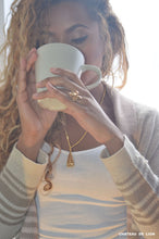 double sided buddha pendant necklace 14k gold plated  or solid made by chateau de lion worn by a model  cdl-neck-dbl-bdha-01- 