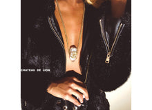 14k gold om crystal amulet neckclace worn by a model made by chateau de lion   cdl-neck-om-crystl-01