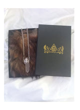 Samadhi clear quarts crystal amulet necklace with sterling silver fluer de lis motif made by chateau de lion front view . cdl-neck-smdhi-clr-qrtz-01