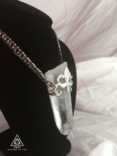 Samadhi clear quarts crystal amulet necklace with sterling silver fluer de lis motif made by chateau de lion side view . cdl-neck-smdhi-clr-qrtz-01