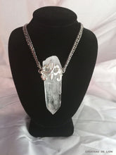 Samadhi clear quarts crystal amulet necklace with sterling silver fluer de lis motif made by chateau de lion front view . cdl-neck-smdhi-clr-qrtz-01