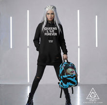 RVR GRL Blue Backpack modeled by female model wearing the queens live forever hoodie with cyber punk vibes by Chateau De Lion