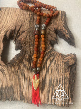 shiva mala necklace with 14 gold arrow pendant made by chateau de lion laying front view cdl-mla-shva-001