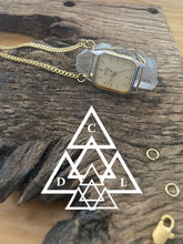 time crystal quartz crystal necklace laying on its side made by chateau de lion cdl-neck-tm-001